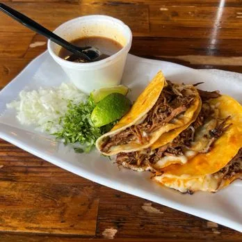 Birria quesitacos with consomé for dipping